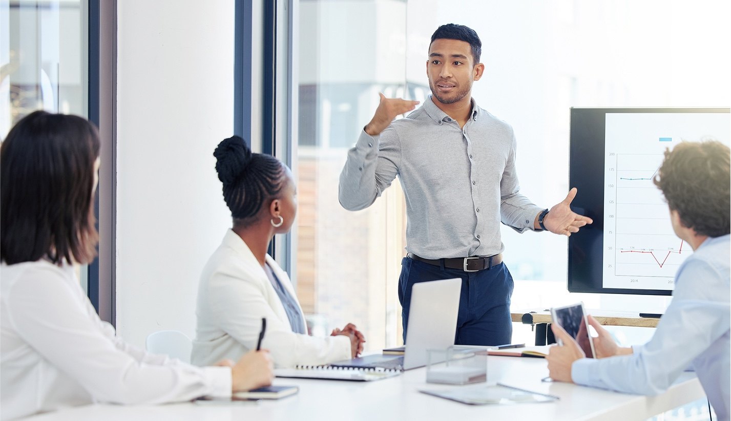 An AR Professional explaining financial automation in a board meeting