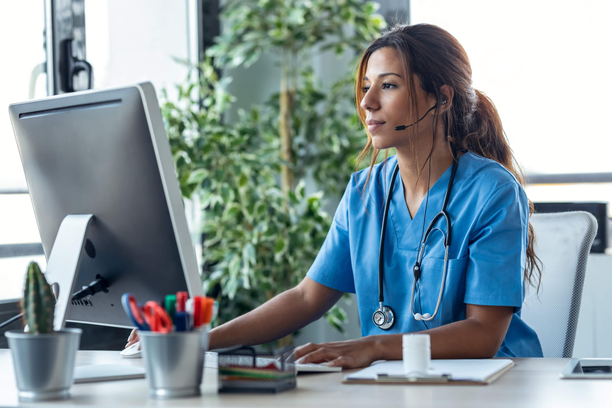 A healthcare worker reviews the payment processing system for digital payments